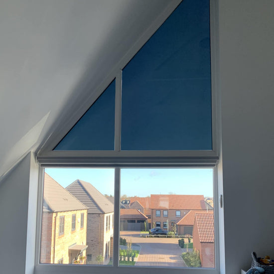 Shaped blind on window