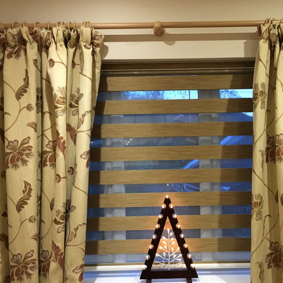 Window fitted with blinds and a curtain