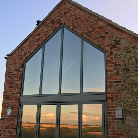 Gable end fitted with window film