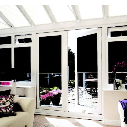 Sitting room with floor to ceiling glass doors and windows