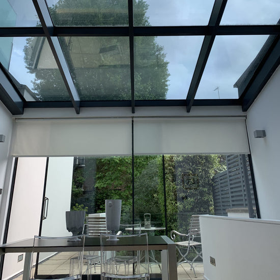 Modern dining room with glass roof