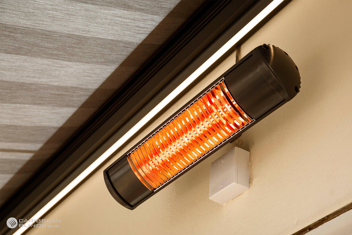 Infrared heater mounted on a wall next to a window