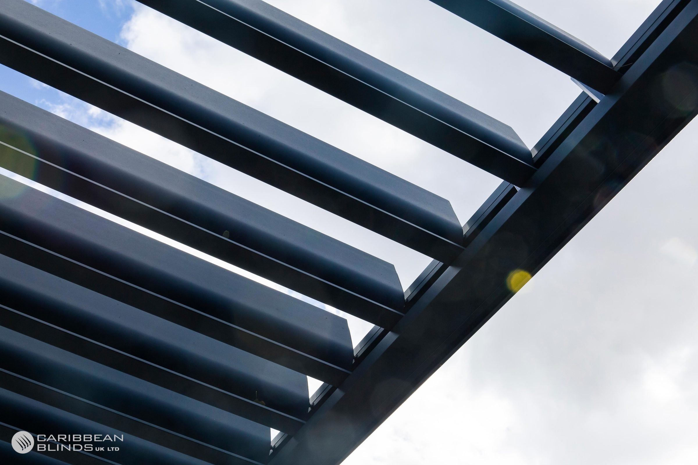 Close-up of a pergola with a blurred outdoor background