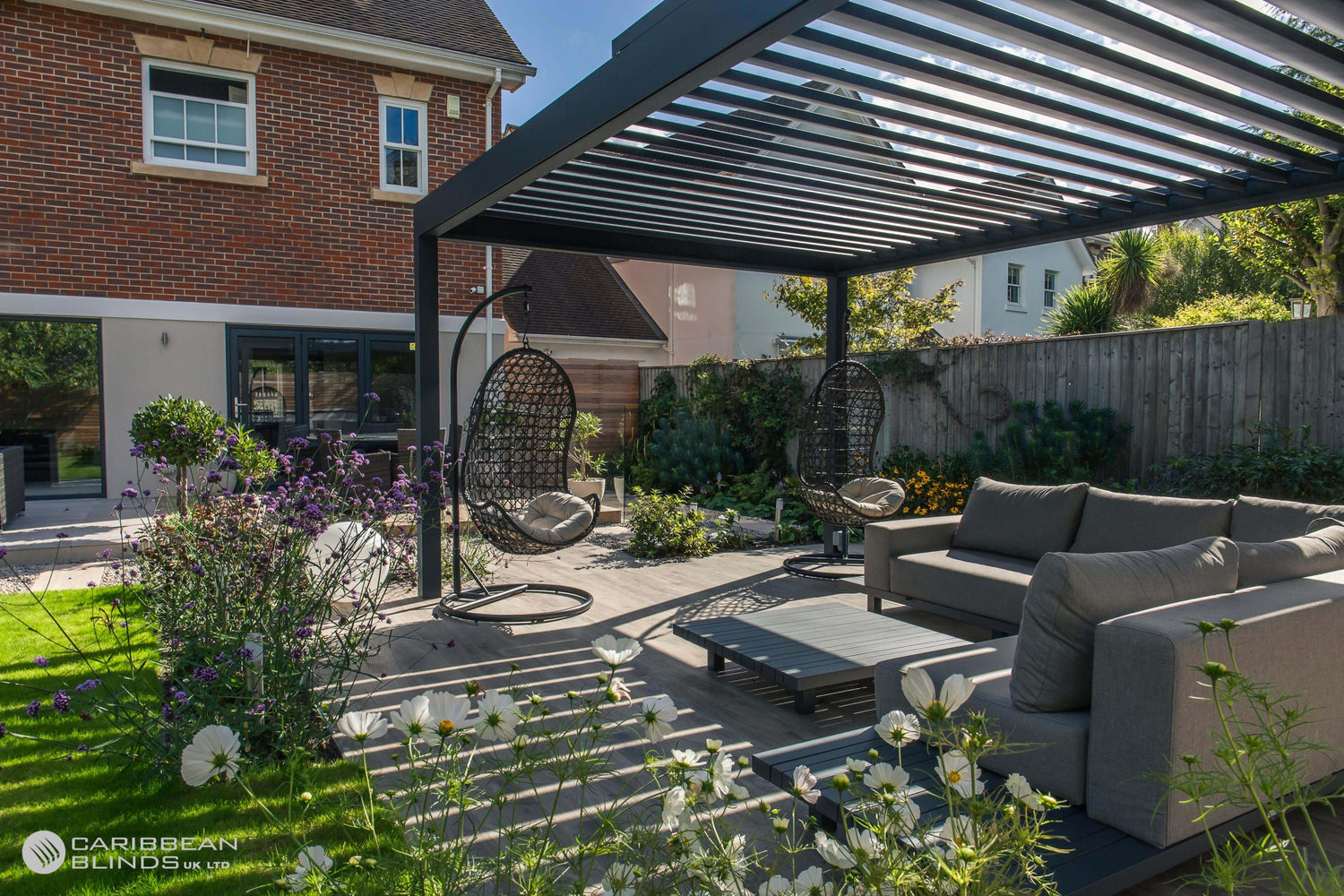 Outdoor patio area with pergola, furniture, and garden.