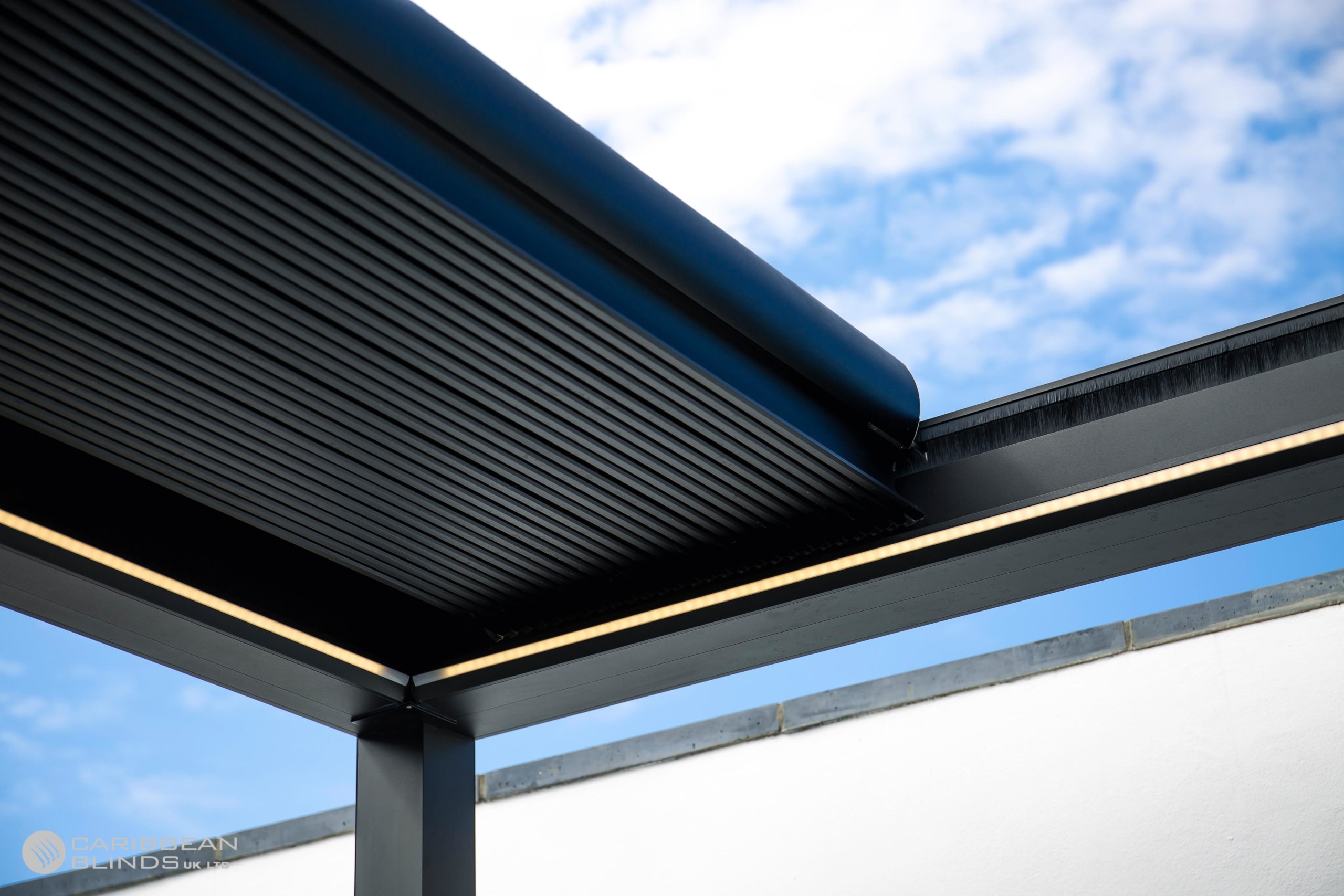 Modern architectural design with a roof overhang and blue sky background