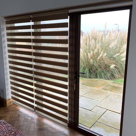 Patio windows and glass door with blinds